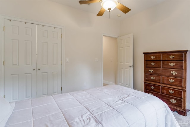 bedroom with ceiling fan and a closet