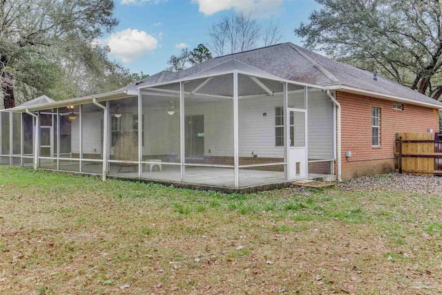 rear view of house featuring a yard and a patio area