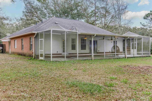 view of front of home with a patio area, ceiling fan, and a front lawn