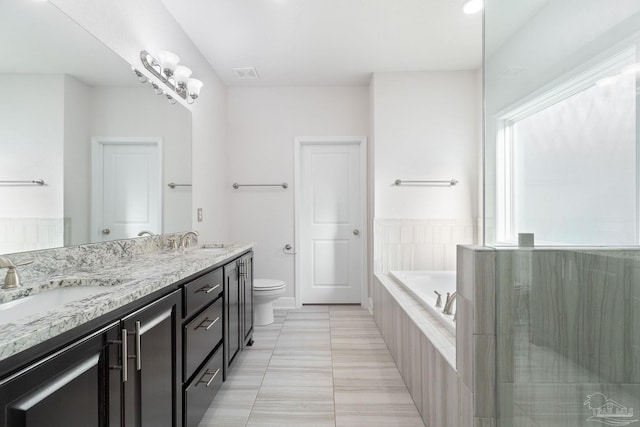 2339 Habersham Ln, Cantonment, FL 32533 - full bathroom featuring a garden tub, toilet, a sink, visible vents, and double vanity