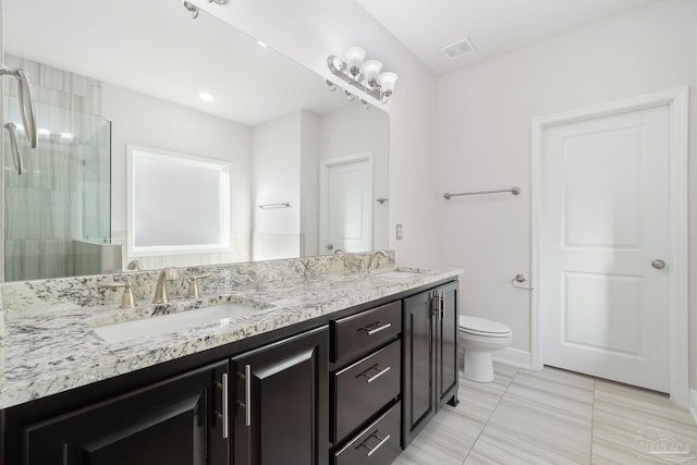 2339 Habersham Ln, Cantonment, FL 32533 - bathroom featuring double vanity, a sink, toilet, and baseboards