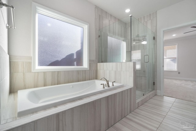 2339 Habersham Ln, Cantonment, FL 32533 - bathroom with a shower stall, ceiling fan, a bath, and tile patterned floors