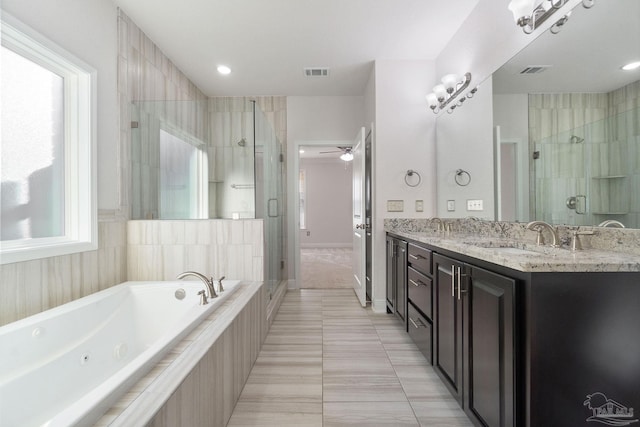2339 Habersham Ln, Cantonment, FL 32533 - bathroom with a whirlpool tub, double vanity, a sink, and visible vents
