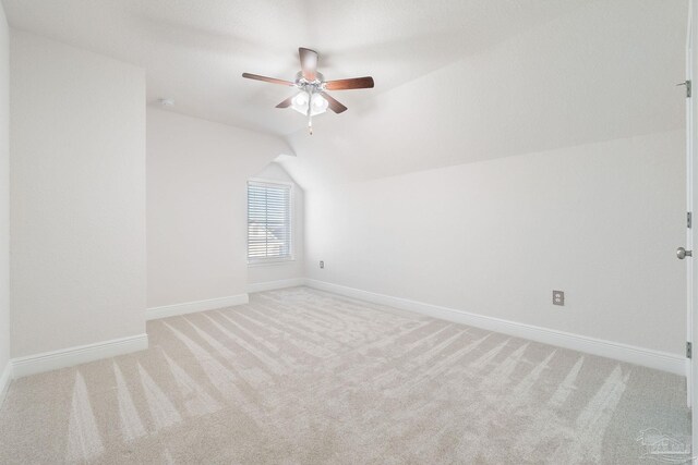 2339 Habersham Ln, Cantonment, FL 32533 - additional living space with baseboards, vaulted ceiling, a ceiling fan, and light colored carpet
