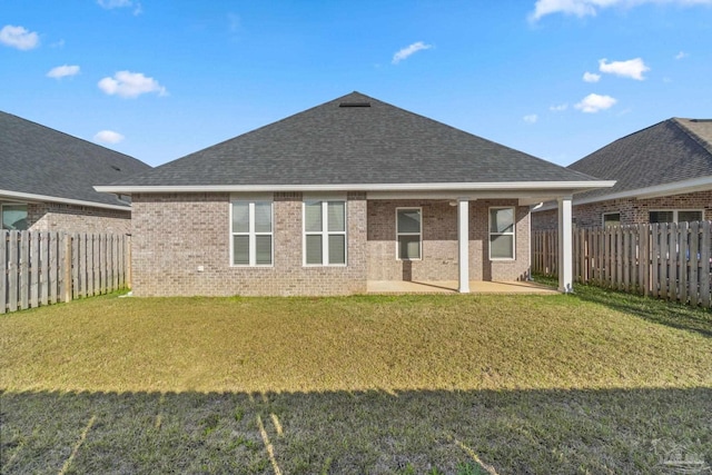 2339 Habersham Ln, Cantonment, FL 32533 - rear view of house featuring a shingled roof, brick siding, and a fenced backyard