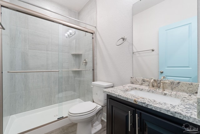 2339 Habersham Ln, Cantonment, FL 32533 - bathroom with vanity, toilet, and a shower stall