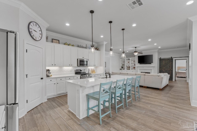 4726 Soundside Dr, Gulf Breeze, FL 32563 - kitchen featuring appliances with stainless steel finishes, ceiling fan, a sink, recessed lighting, and white cabinets