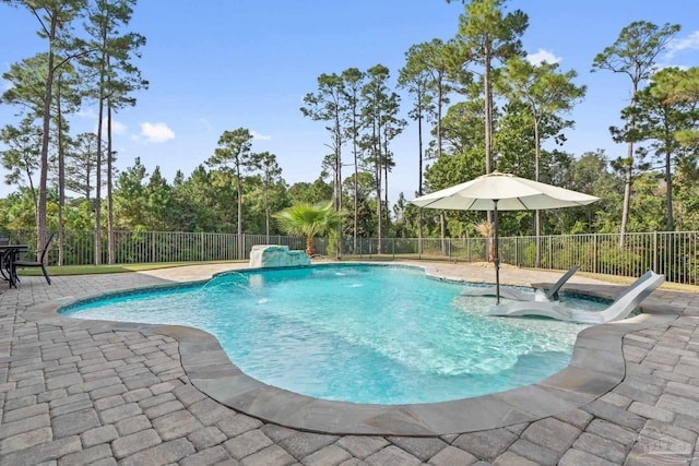 view of swimming pool featuring a patio, pool water feature, and a jacuzzi