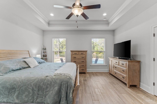 bedroom with light hardwood / wood-style floors, ornamental molding, multiple windows, and ceiling fan