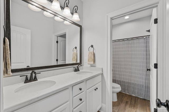 4726 Soundside Dr, Gulf Breeze, FL 32563 - bathroom with toilet, double vanity, wood finished floors, and curtained shower