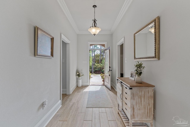 entryway featuring ornamental molding and light wood-type flooring