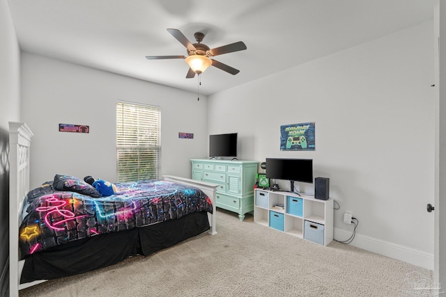 bedroom with light colored carpet and ceiling fan