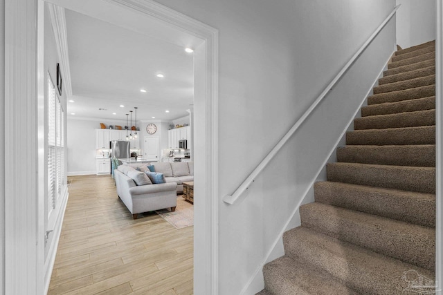 staircase featuring wood-type flooring