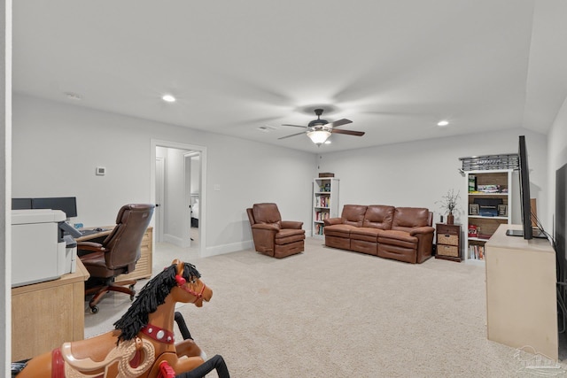 carpeted living room featuring ceiling fan