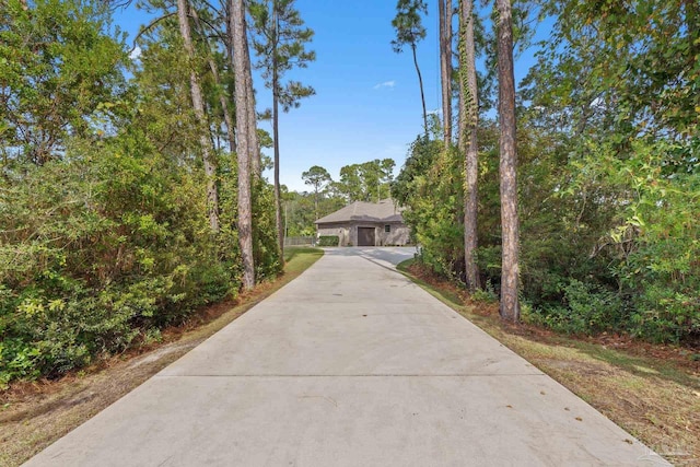 4726 Soundside Dr, Gulf Breeze, FL 32563 - view of community featuring concrete driveway and an attached garage