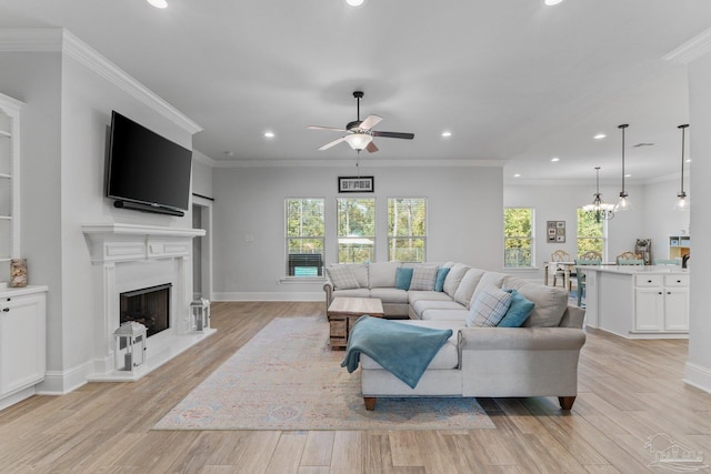 living room with ornamental molding and light wood-type flooring