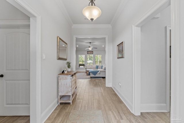 4726 Soundside Dr, Gulf Breeze, FL 32563 - living room with light wood-style flooring, a fireplace with raised hearth, crown molding, baseboards, and recessed lighting
