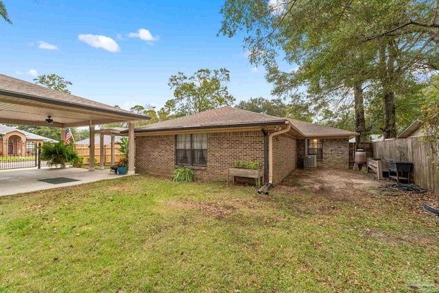 view of property exterior with a lawn, ceiling fan, cooling unit, and a patio area