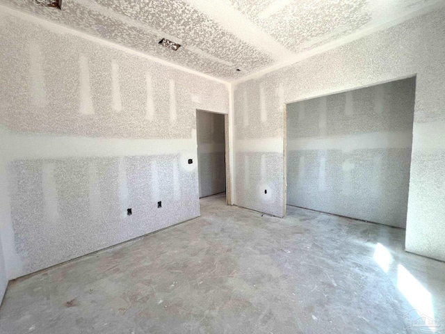 spare room with concrete flooring