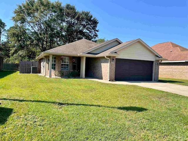 ranch-style house with a garage and a front lawn