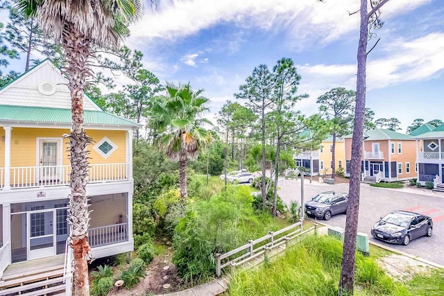 exterior space featuring a residential view and fence