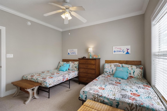 bedroom featuring ornamental molding, carpet flooring, and ceiling fan