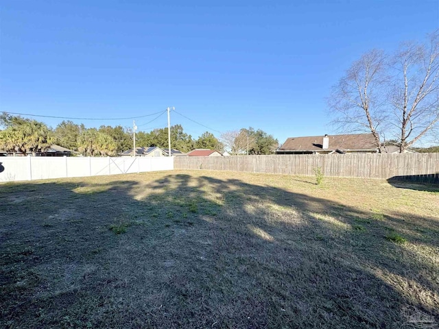 view of yard featuring a fenced backyard