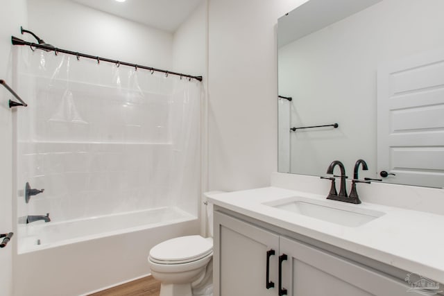 bathroom with vanity, toilet, shower / tub combo with curtain, and wood finished floors