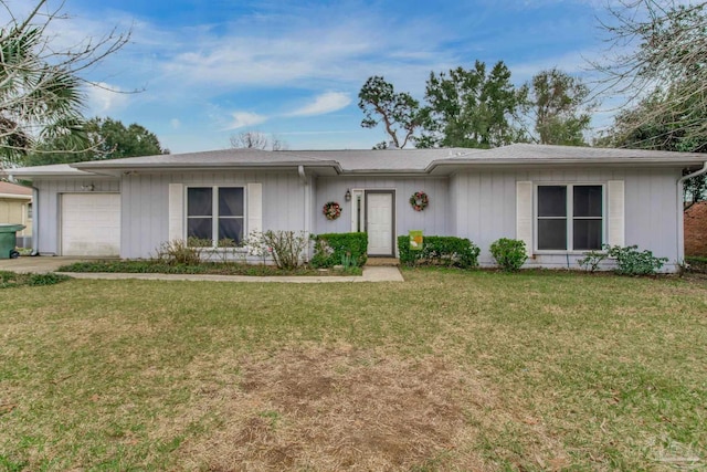 ranch-style house with a garage, a front lawn, and concrete driveway