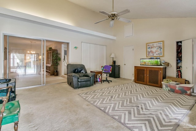 sitting room featuring carpet floors, high vaulted ceiling, and ceiling fan with notable chandelier