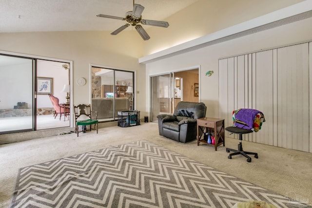 sitting room featuring carpet, high vaulted ceiling, and ceiling fan