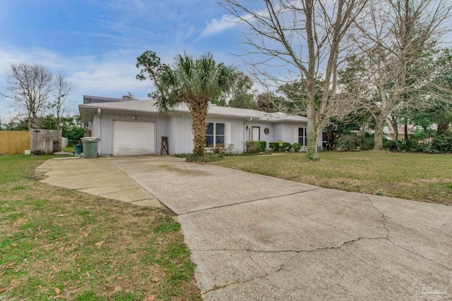 single story home with a garage, concrete driveway, a front lawn, and fence