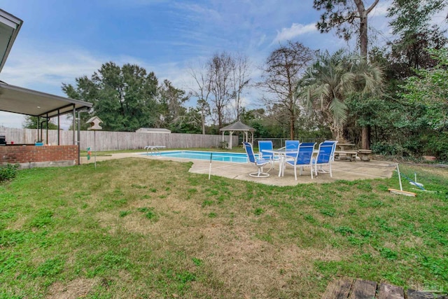 view of yard featuring a fenced in pool, a patio area, and a fenced backyard