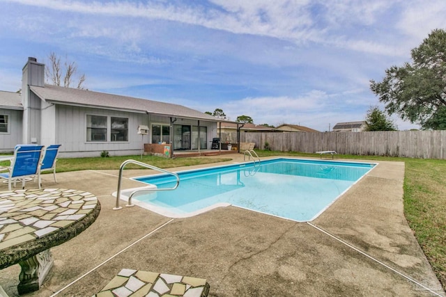 view of swimming pool featuring a fenced in pool, a fenced backyard, and a patio