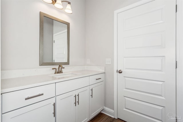 bathroom featuring vanity and wood-type flooring