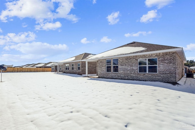 view of snow covered property