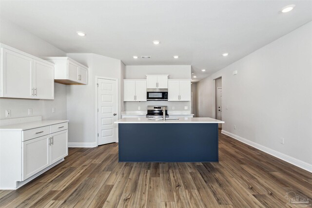 kitchen featuring white cabinetry, sink, a kitchen island with sink, and appliances with stainless steel finishes