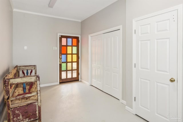 foyer entrance featuring crown molding