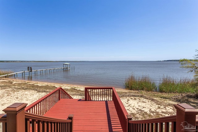 dock area with a water view