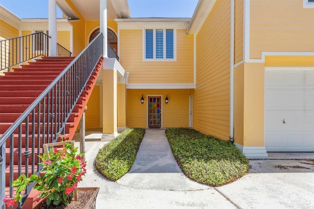 doorway to property with a garage