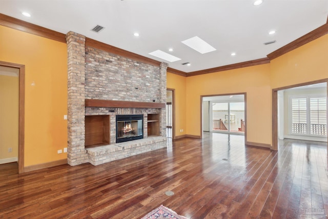 unfurnished living room with crown molding, plenty of natural light, and wood-type flooring