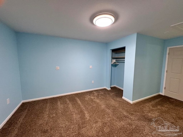 unfurnished bedroom with a closet and carpet floors