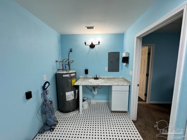 interior space featuring electric panel, water heater, sink, and carpet flooring