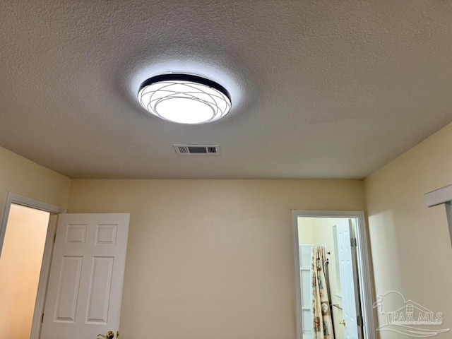 interior details with a textured ceiling