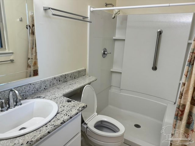 bathroom with a shower with shower curtain, toilet, and vanity