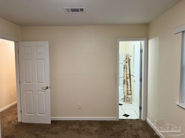 unfurnished room with carpet flooring