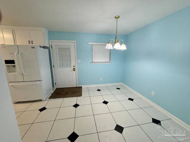 interior space with a chandelier and light tile patterned floors