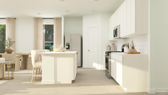6377 Buckthorn Cir Lot 14E, Pace, FL 32571 - kitchen with stainless steel appliances, light wood finished floors, backsplash, and white cabinets