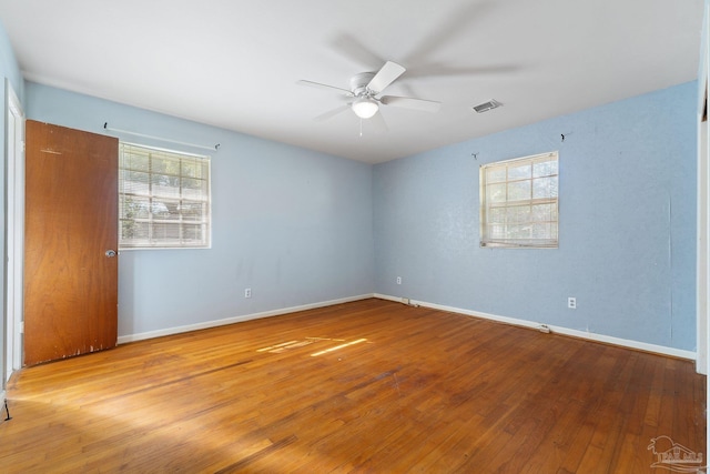 spare room featuring ceiling fan and light hardwood / wood-style floors