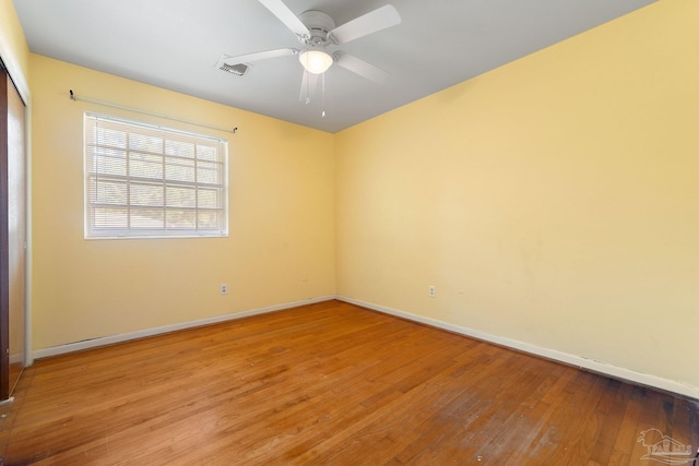 unfurnished room featuring hardwood / wood-style flooring and ceiling fan